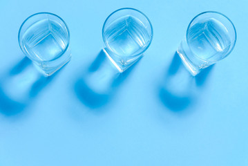 top of view of drink glasses with water, nutrition and health-care concept, nutrition and health-care concept on white background