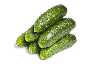 Gherkins isolated on white background. Heap of fresh gherkins