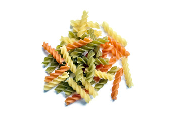 Fusilli tricolore pasta isolated on a white background. Heap of uncooked pasta