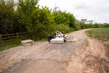 Country road blocked by fly tipping