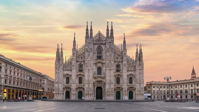 Milan Italy time lapse 4K, city skyline sunrise timelapse at Milano Duomo Cathedral nobody empty due to Coronavirus Covid-19 lockdown