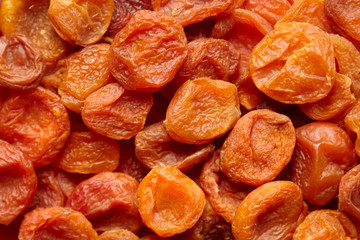 Dried apricots background. Heap of dry apricot fruits