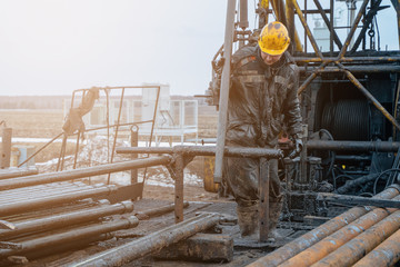 Offshore oil rig worker prepare tool and equipment for perforation oil and gas well at wellhead...