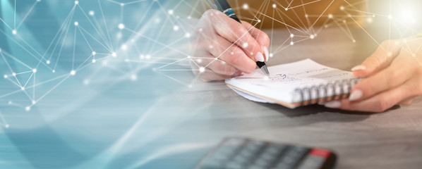 Female hands writing on notepad; panoramic banner