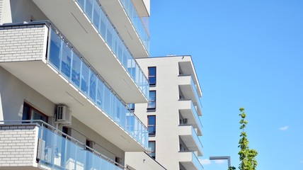Residential Building on sky background. Facade of a modern housing construction with of balconies.