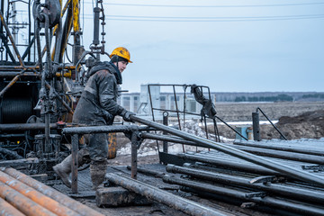 Workover rig working on a previously drilled well trying to restore production through repair....