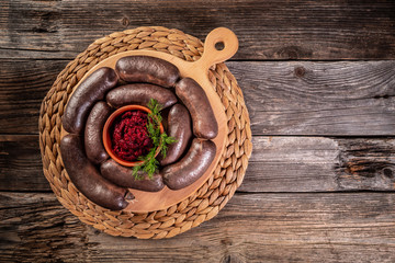 Whole blood sausage. Meat product in natural intestine casings. Blood sausage or black pudding,...