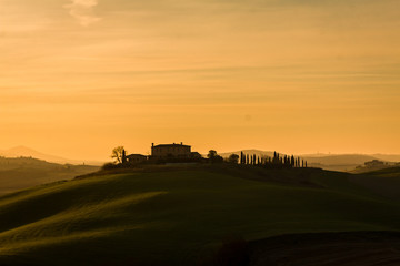 Amazing sunset in Val d'Orcia hills , Tuscany Italy