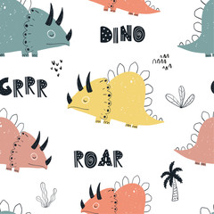 Vector hand-drawn colored seamless repeating children pattern with cute dinosaurs, plants and doodles in Scandinavian style on a white background. Baby pattern with dinosaurs. Cute baby animals.  © ZHUKO