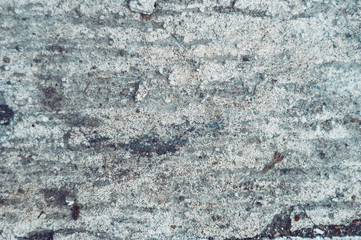 Old gray painted concrete with black scuffed rustic background, horizontal orientation, top view....