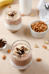 Chia seeds pudding with chocolate and banana smoothie in a glass