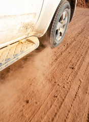 old car tire on dirt track in dessert