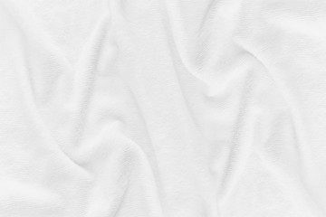 Close-up of white fabric texture background. Abstract crumpled cloth.