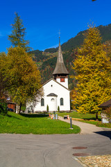 Lauterbrunnen Valley in Alps mountains and church, Berner Oberland - 344118426