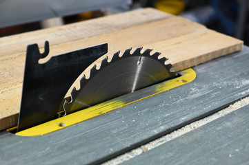Close up look to wood saw. Workshop detail.