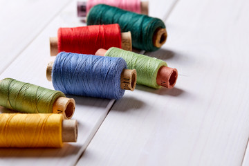 bobbins with thread and needles