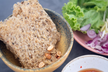 Thai traditional crispy catfish salad
