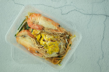 Thai fried noodles with big river shrimp in box