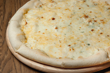 cooked pizza with cheese close-up
