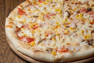 cooked pizza with cheese close-up
