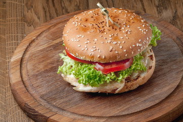 burger with latch on a wooden tray