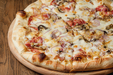 cooked pizza with cheese close-up
