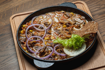 baked meat stew with vegetables in a pan