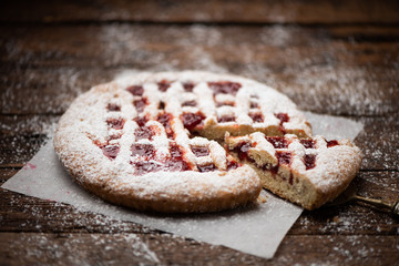  Home made strawberry pie on wooden table