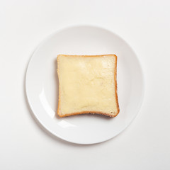 slice of wheaten bread spreaded with butter