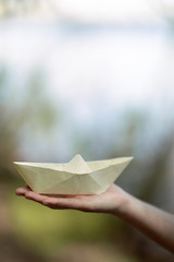 paper boat female hand
