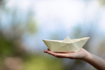 paper boat female hand