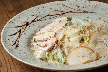 salad with chicken, tomatoes, bread, cheese and vegetables