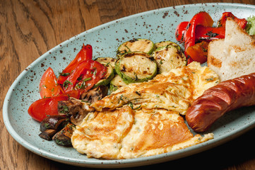 omelet with toasted sausage and baked vegetables