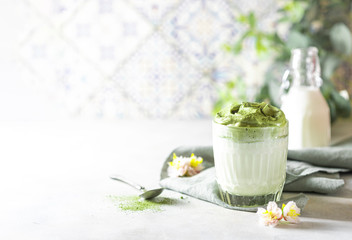 Fototapeta na wymiar Match Dalgona Latte, Match cream, on a white background. Matcha green tea.