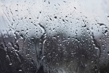 rainy days, rain drops on the window surface