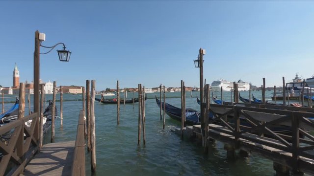 SLOW MOTION - A large cruise ship sails past the Piazza San Marco (St Mark`s Square) in Venice. San Marco is the main landmark of Venice. Romantic travel across Venice, Italy.