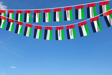 UAE flag festive bunting hanging against a blue sky. 3D Render
