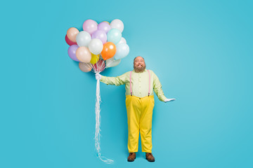 Full length body size view of his he nice attractive cheerful cheery bearded mature guy holding in...