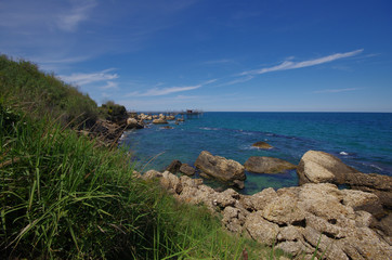 Fototapeta na wymiar The cliff of the Abruzzo coast and in the background a characteristic fishing machine