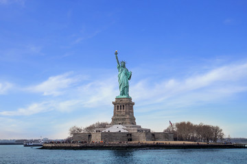 Fototapeta premium The Statue of Liberty in New York City, Statue of Liberty on the background of colorful dawn sky,