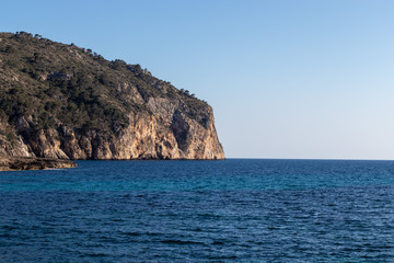 Fototapeta na wymiar Rocks beautiful beach turquoise sea water, Camp de Mar, Majorca island, Spain