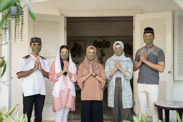 muslim social distancing. eid mubarak during pandemic. family meeting and greeting without physical touching
