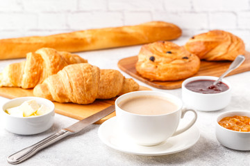 Breakfast with coffee and croissants
