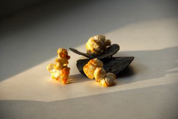 Black chips and funny caramel popcorn.