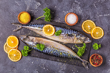 raw mackerel with spices on the board
