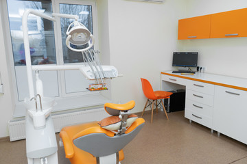 Interior stylish modern dentist office in orange style.