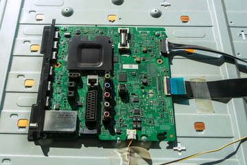 Circuit Board LCD TV. The front side is green with resistors. Close-up