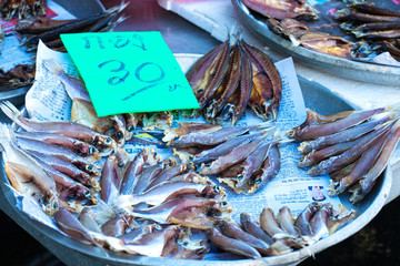 Fresh seafood on the counter at the fish market by the ocean.