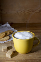 Yellow cup with sugar cubes