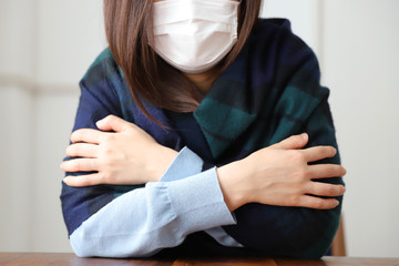 体調不良の女性